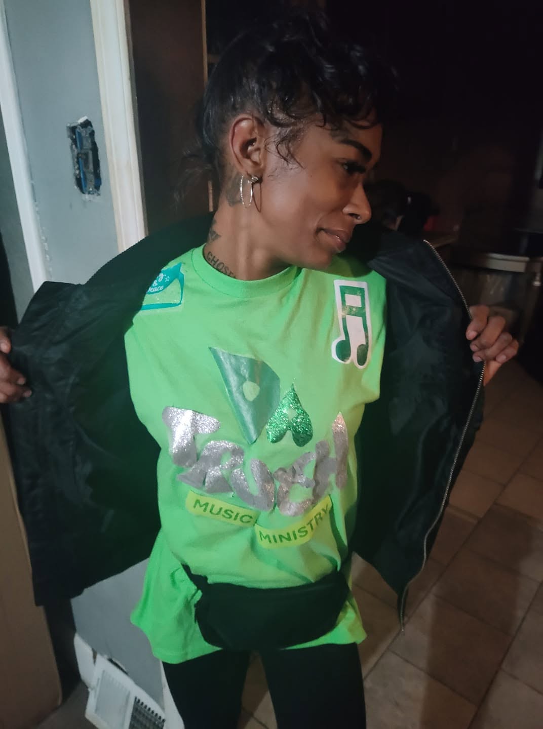 Wearing a Faith Hop tee